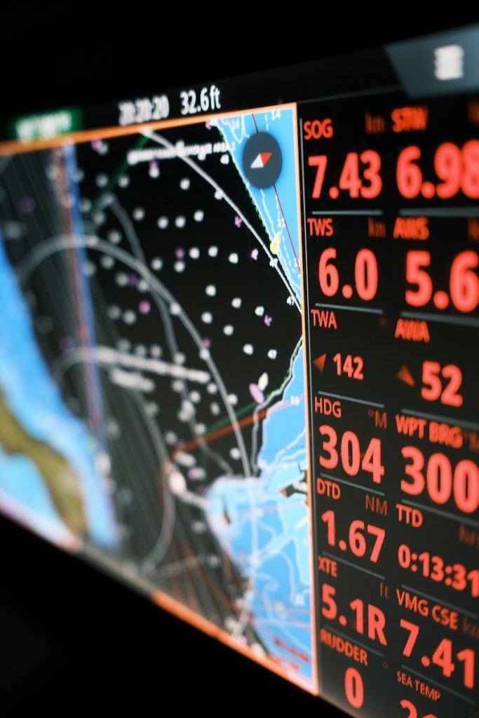 Nautical navigation screen displaying charts and data.