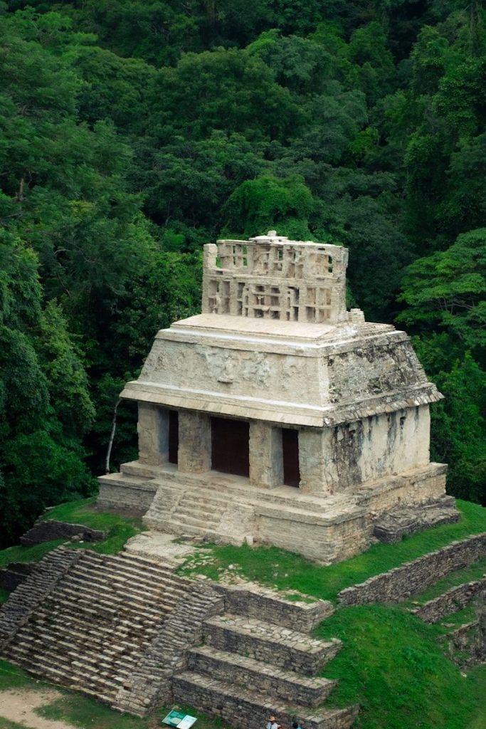 Ancient stone temple nestled in a lush green jungle.