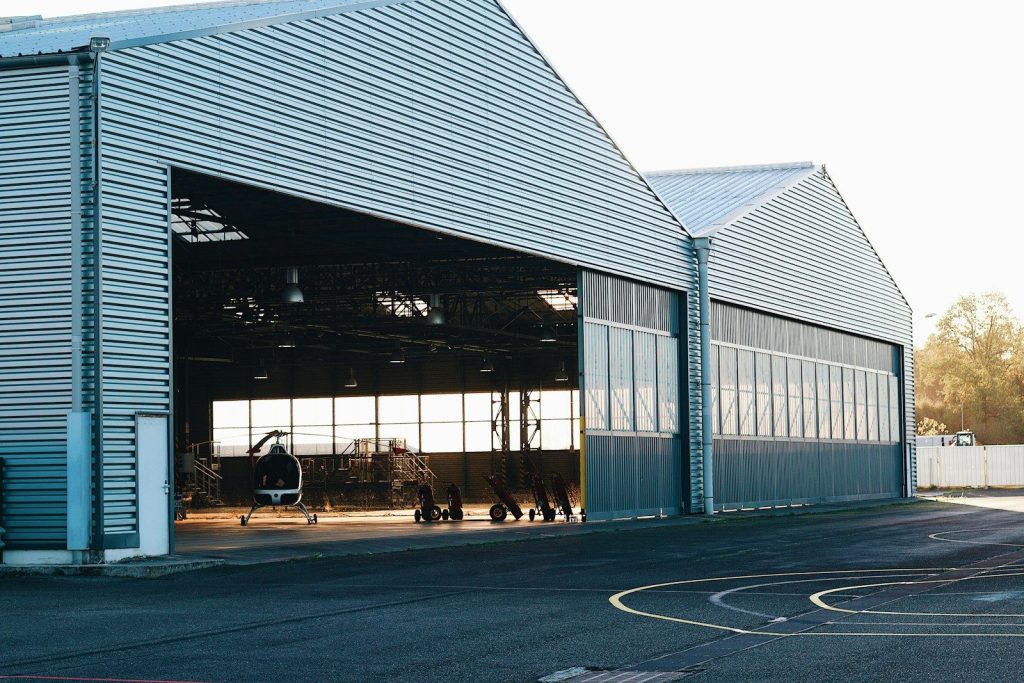 a large metal building with lots of windows