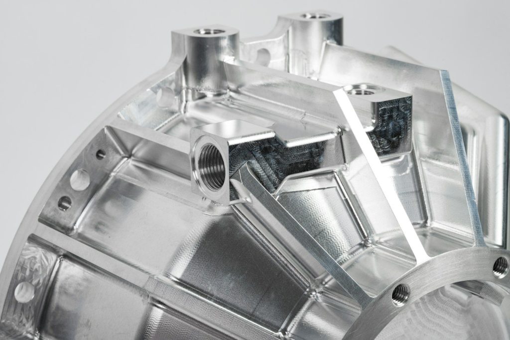 a close up of a metal object on a white surface