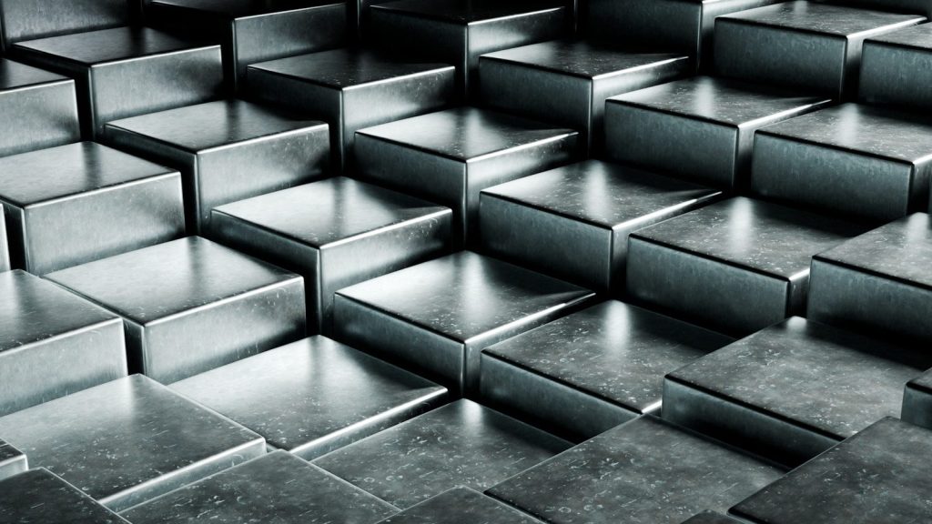 Abstract metallic cubes arranged in a stepped pattern.