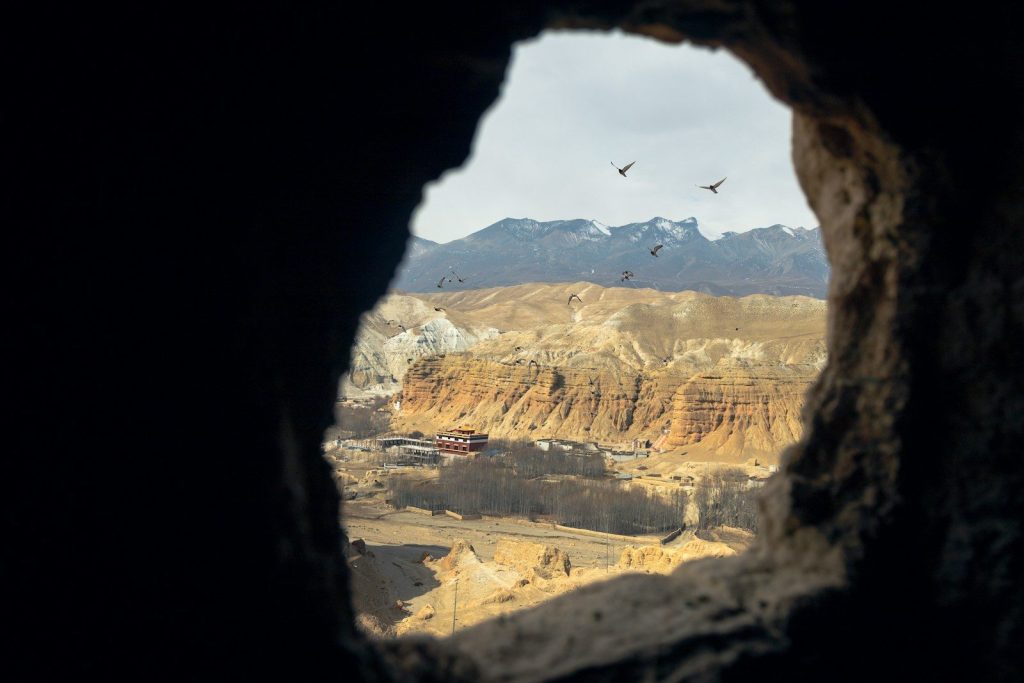 View of a quarry through a cave opening