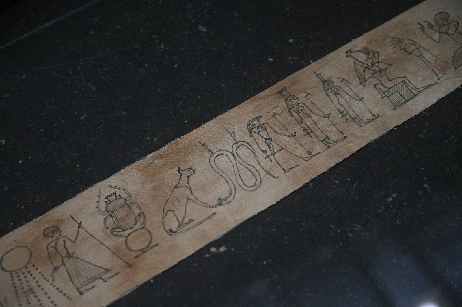 Ancient egyptian hieroglyphs on papyrus scroll