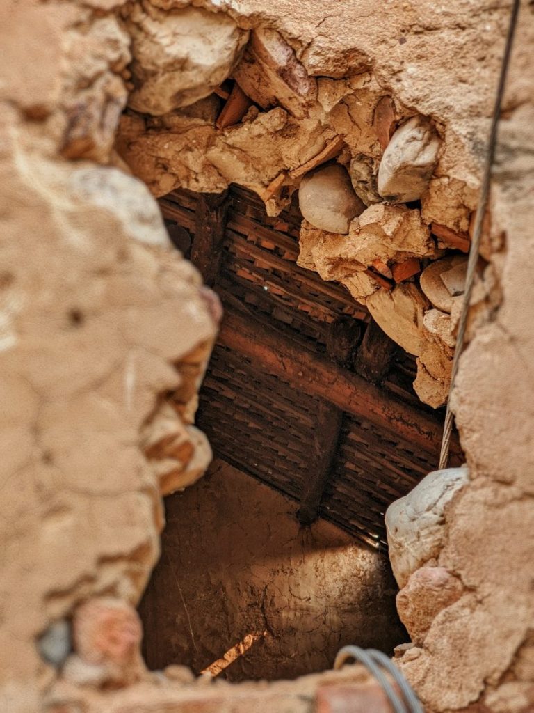 A close up of a hole in a wall