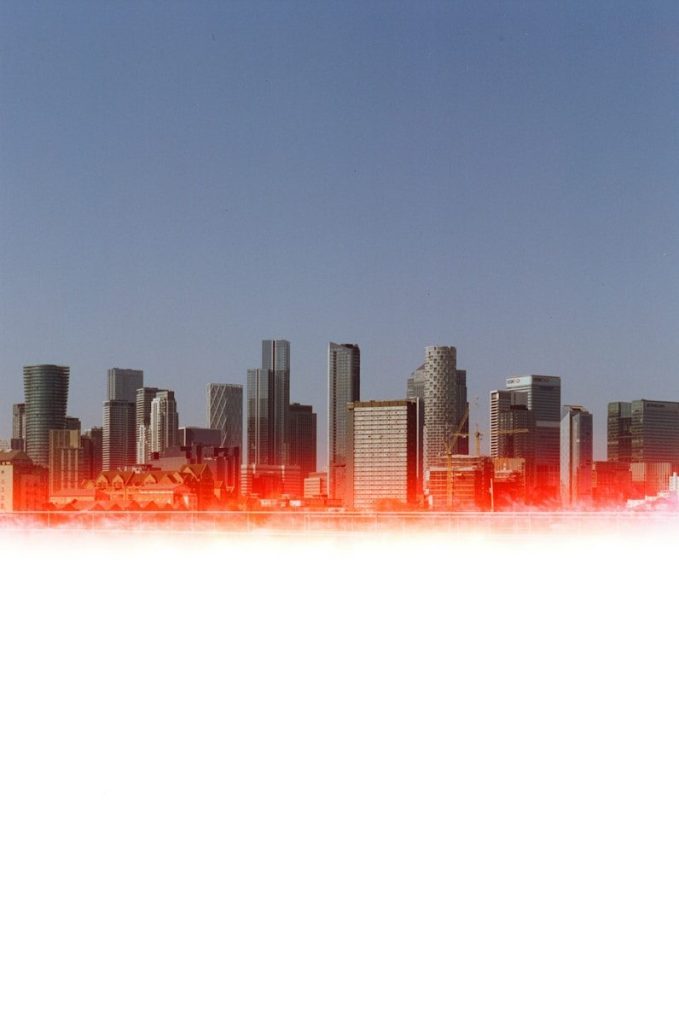 City skyline with red glow at the bottom.