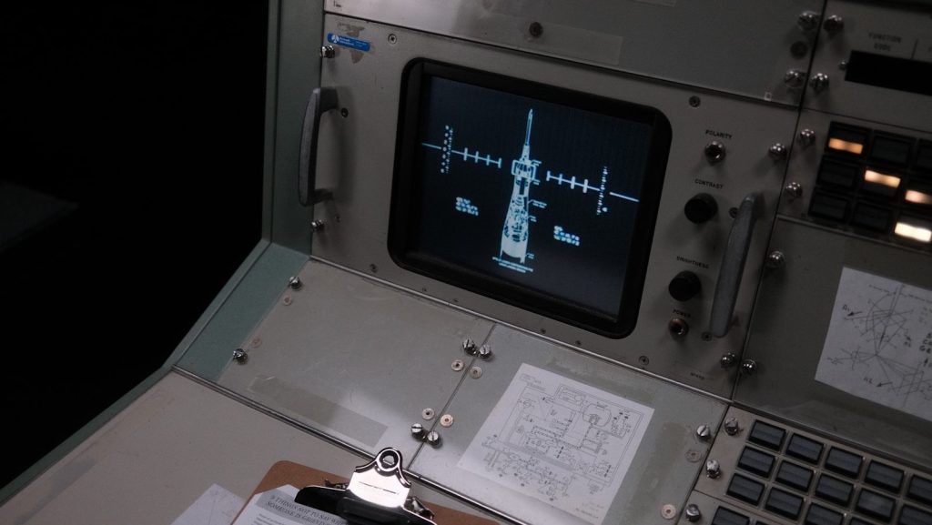 The control panel of a space station with notes on it