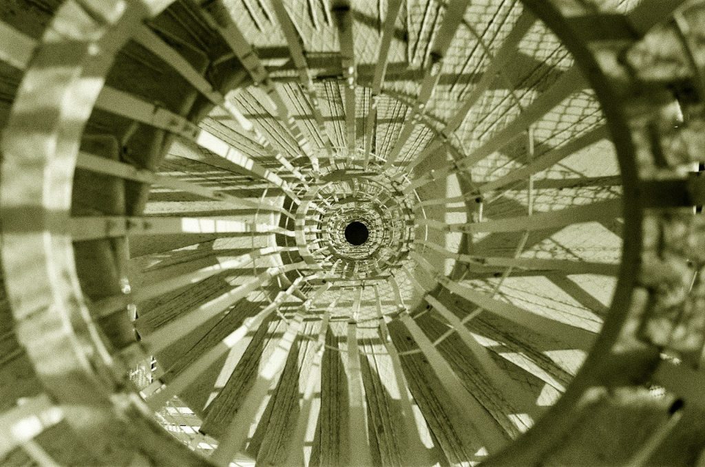a close up of a circular object in sepia