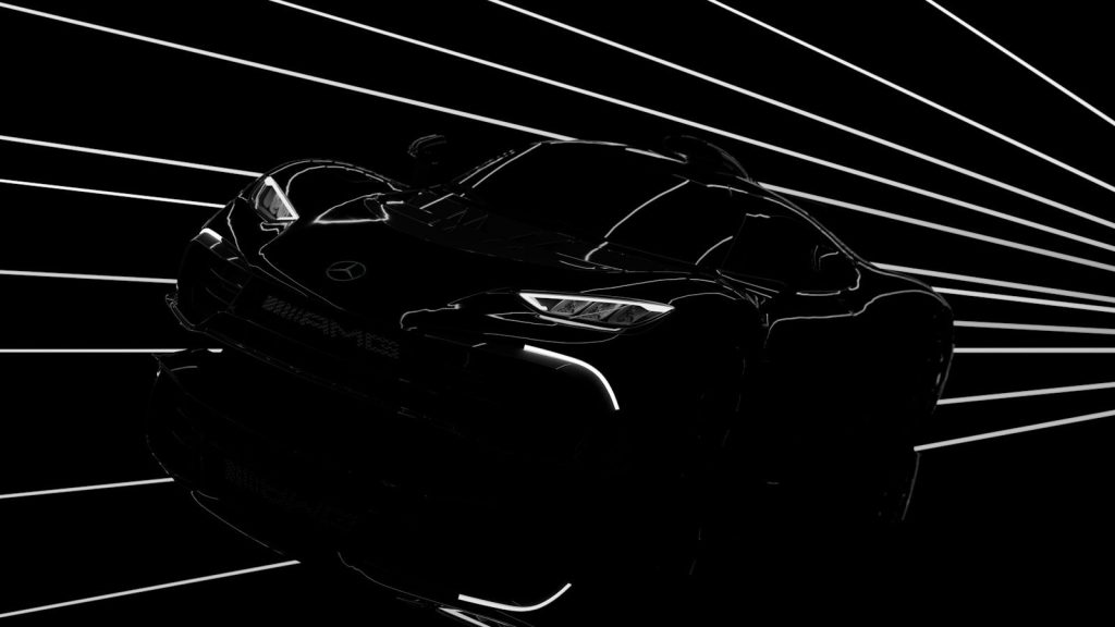 Sleek sports car illuminated against a dark background.