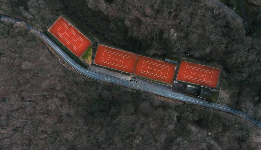 An aerial view of a road with red signs on it