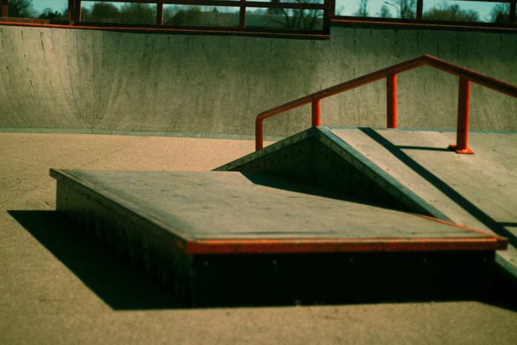 Empty skate park with ramps and rails