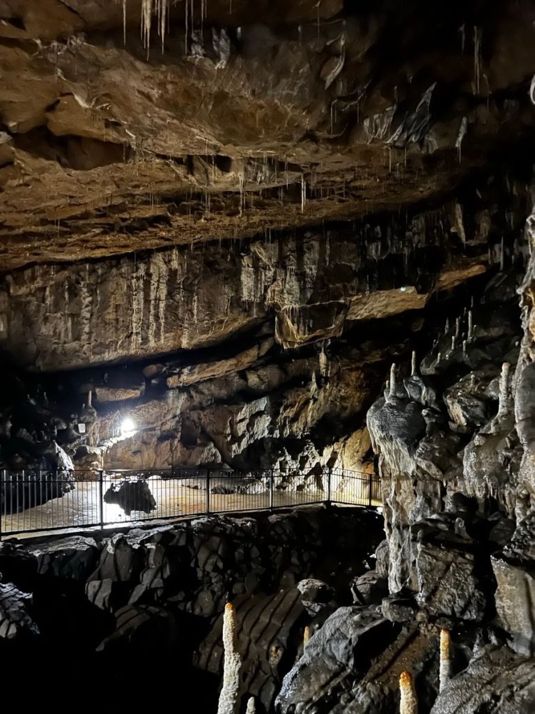 Explore the captivating stalactites and stalagmites in this English cave.