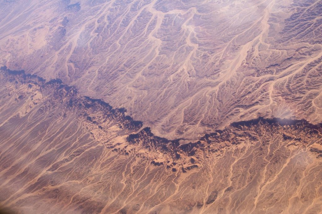 Stunning aerial view capturing the intricate patterns and textures of Egypt's expansive desert terrain.