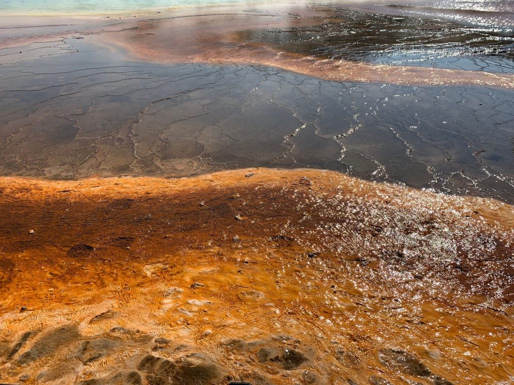 Explore the stunning colors of a geothermal landscape captured in vivid detail.