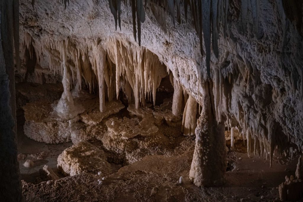 Explore this stunning cave with captivating stalactites and stalagmites formations.