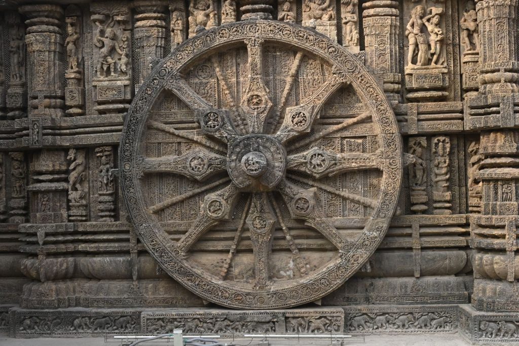 Detailed view of the stone wheel at Konark Sun Temple, a symbol of time in Hindu mythology.