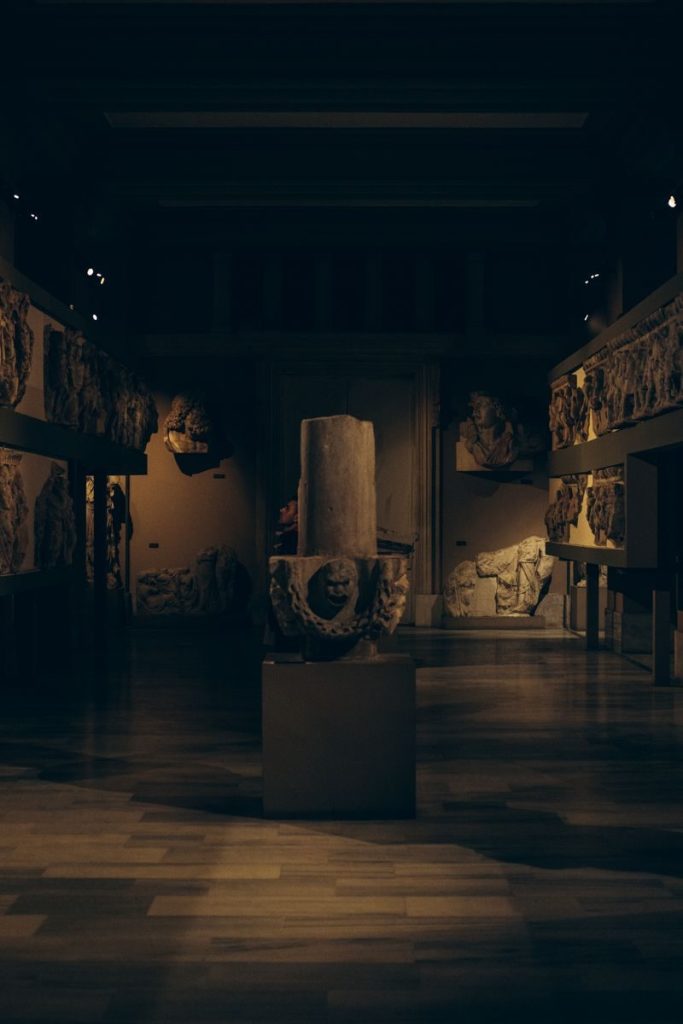 Discover ancient artifacts in a dimly lit Turkish museum interior, showcasing history and archaeology.