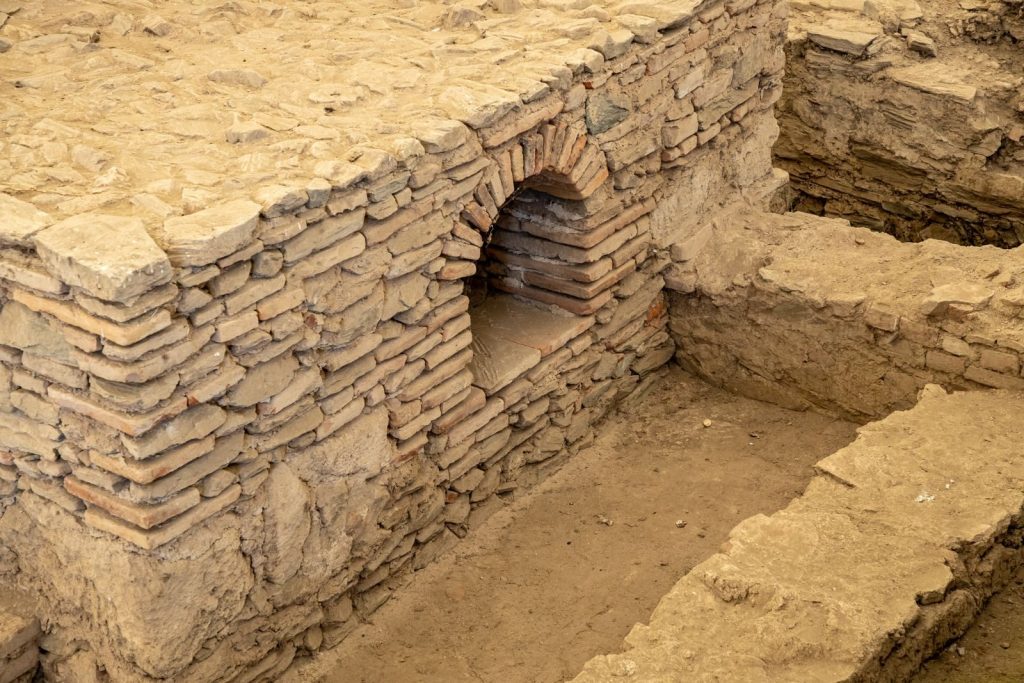 Detailed view of ancient masonry ruins at an archaeological excavation site.