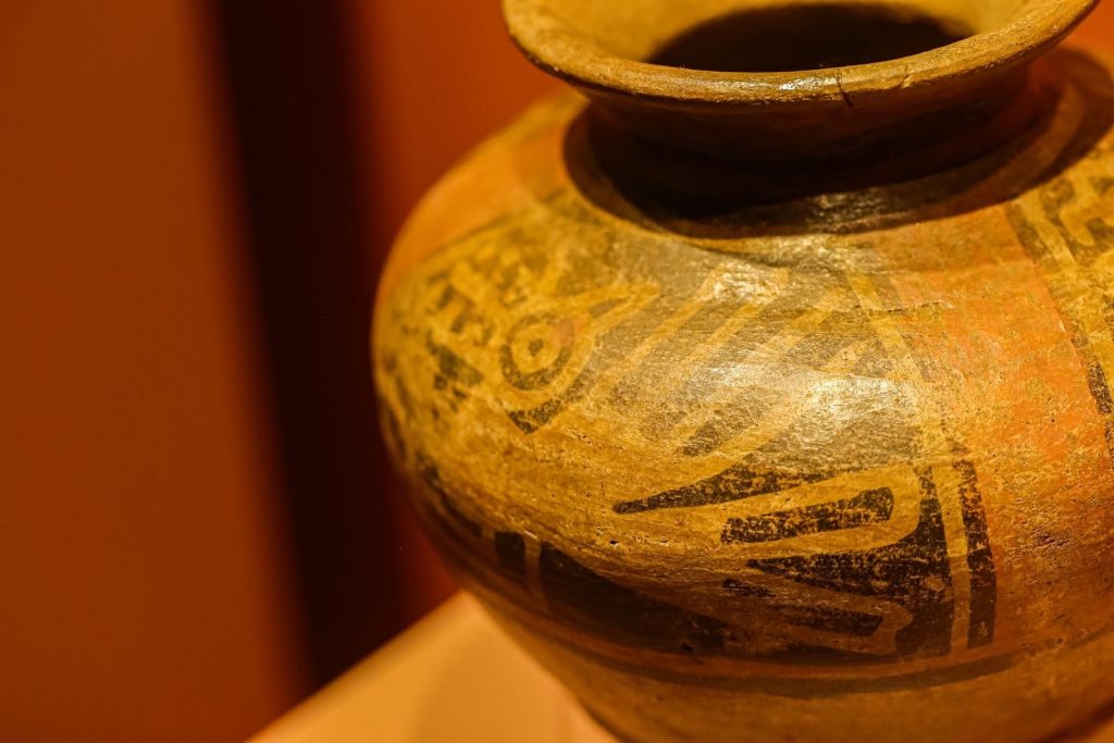 Close-up of an ancient pottery piece showcasing intricate decorative patterns.