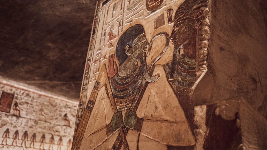 a stone sculpture of a man and a woman