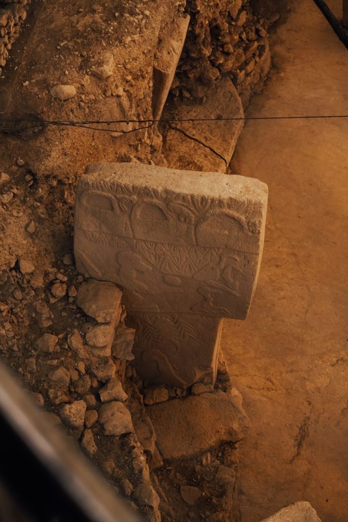 A detailed view of an ancient stone pillar at Göbekli Tepe in Şanlıurfa, Türkiye.