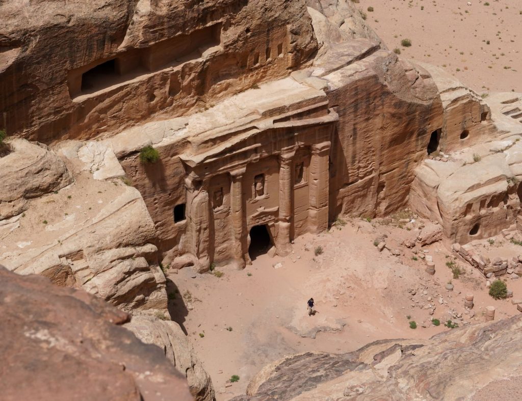 Aerial view of historic Nabatean tombs carved into rocks in Petra, Wadi Musa, Jordan.