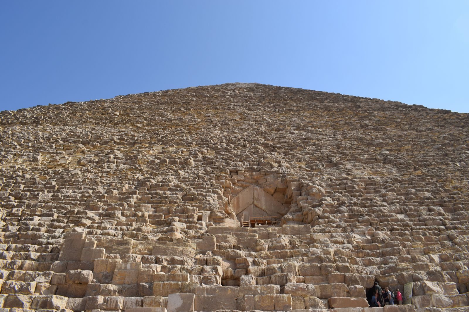 Close-up image of the Great Pyramid of Giza, showcasing its ancient architecture under a clear sky.