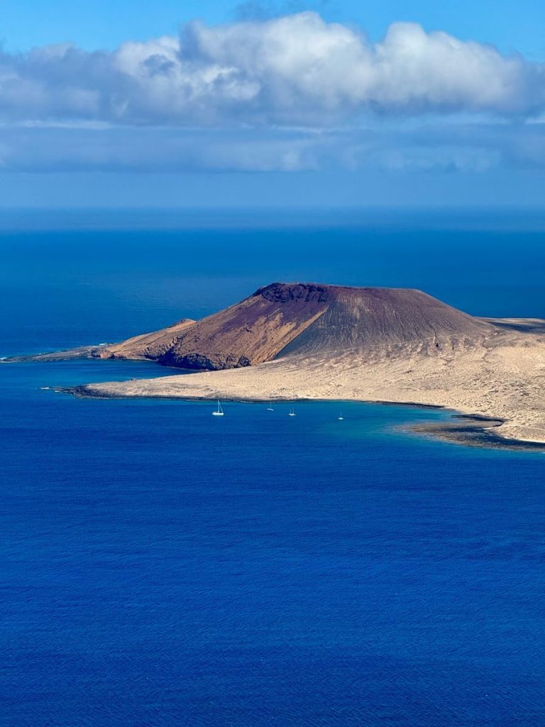 A breathtaking aerial view of the volcanic landscape on La Graciosa Island in Lanzarote, Canary Islands.