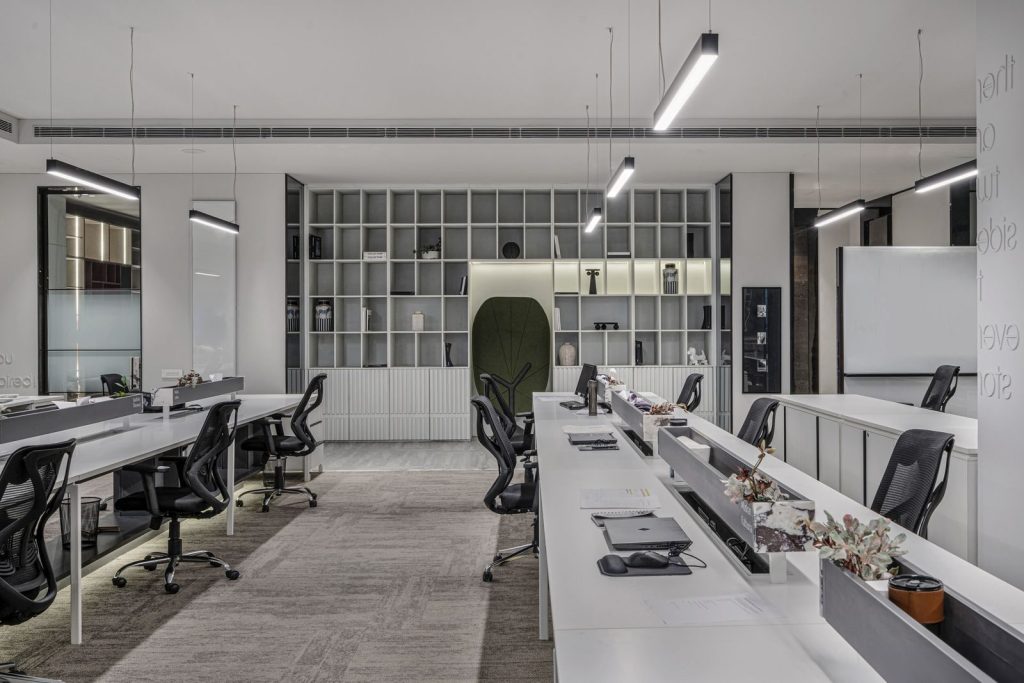 Explore this modern luxury office interior with open workspaces and sleek minimalist design.