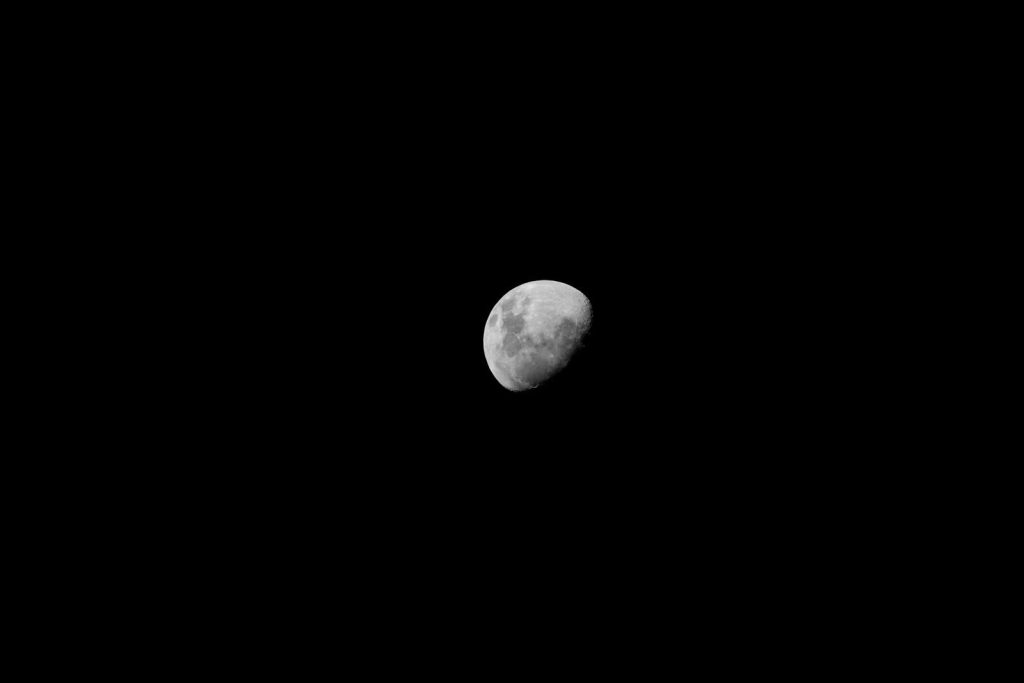High-resolution image of the crescent moon with clear details against a black sky.
