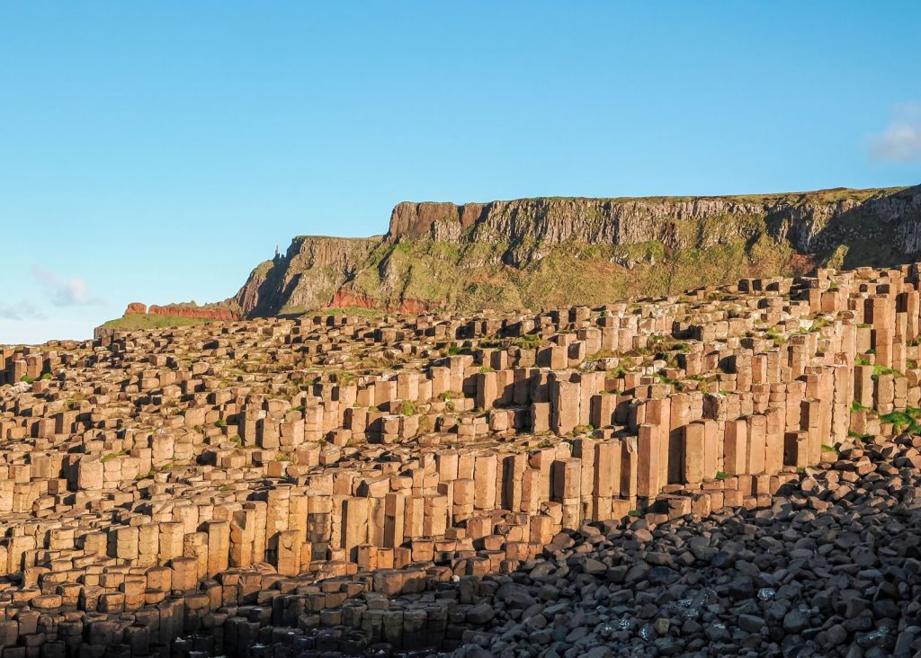 Stunning view of Giant's Causeway with hexagonal basalt columns and cliffs.