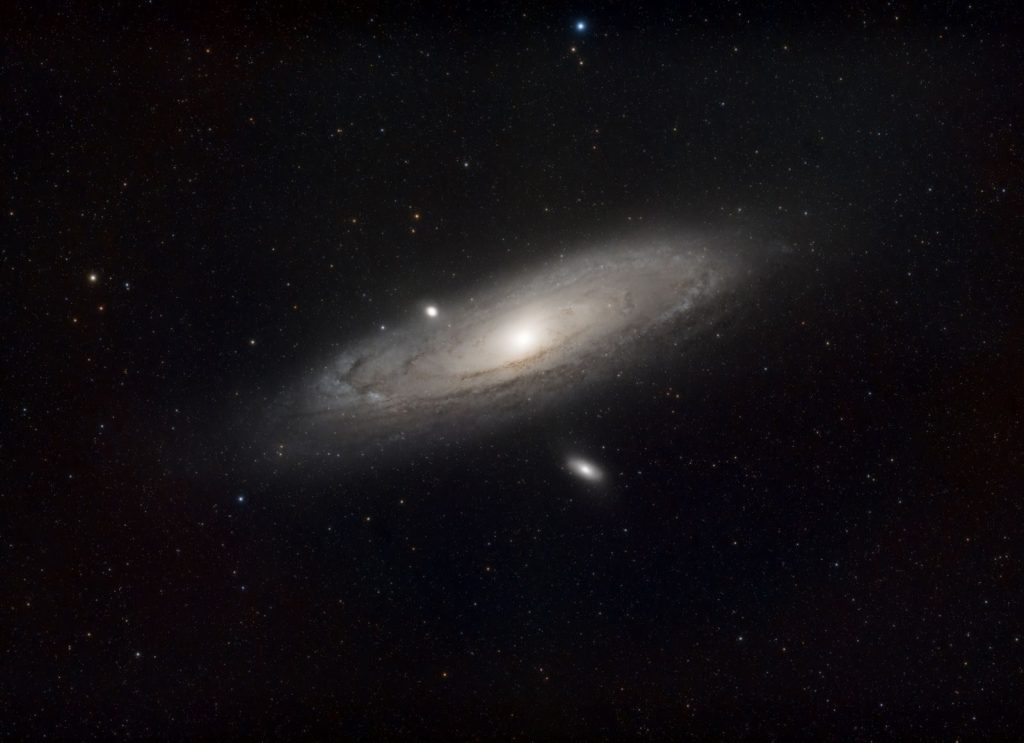 A breathtaking image of the Andromeda Galaxy against a starry sky, showcasing its spiral structure.