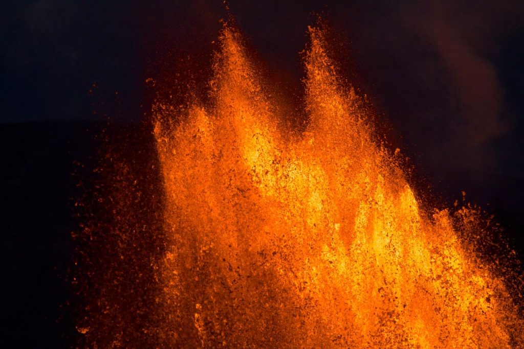 Captivating lava eruption at Hawaii Volcanoes National Park, showcasing nature's raw power.