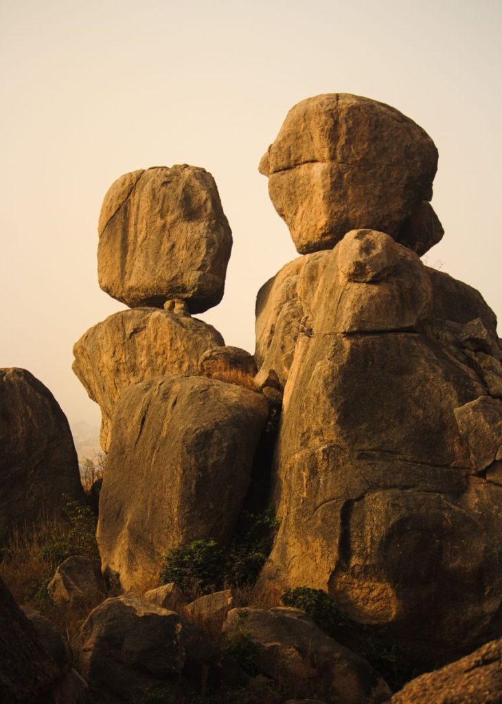 Stunning sunrise view of balanced rock formations in a serene outdoor setting.