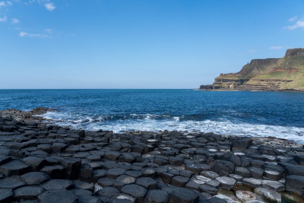 Explore the stunning hexagonal basalt columns at Giant's Causeway, Northern Ireland.