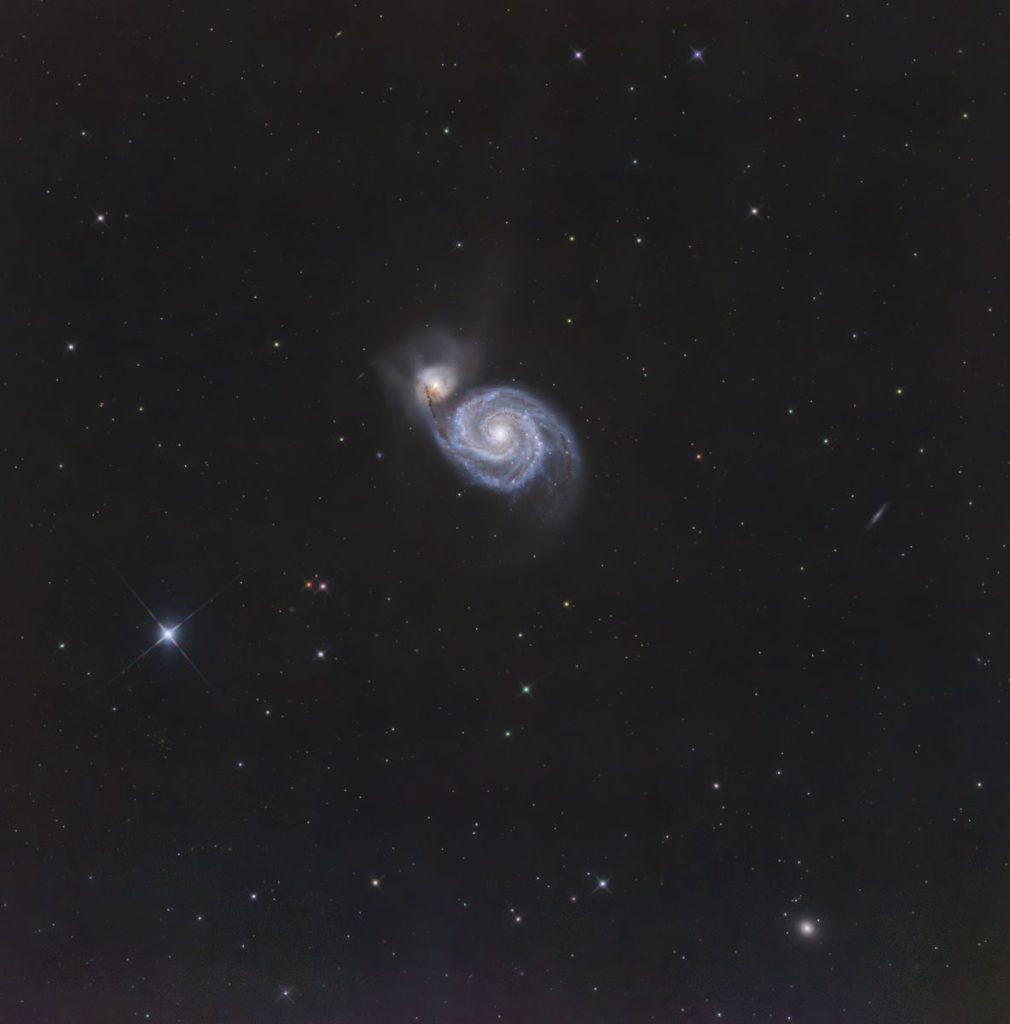 Stunning view of a spiral galaxy amidst stars in deep space.