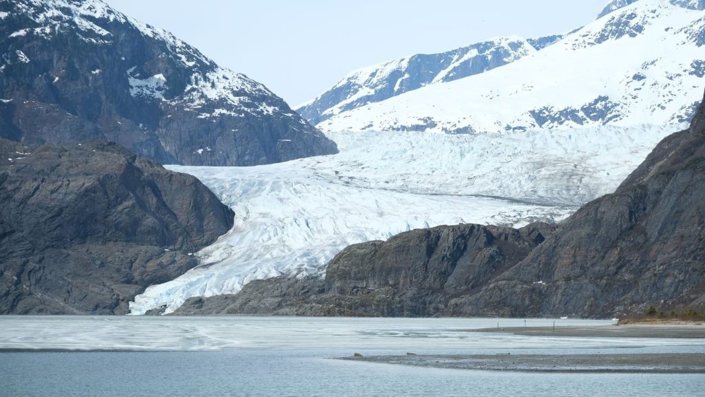 Breathtaking view of Mendenhall Glacier in Juneau, reflecting serene natural beauty.
