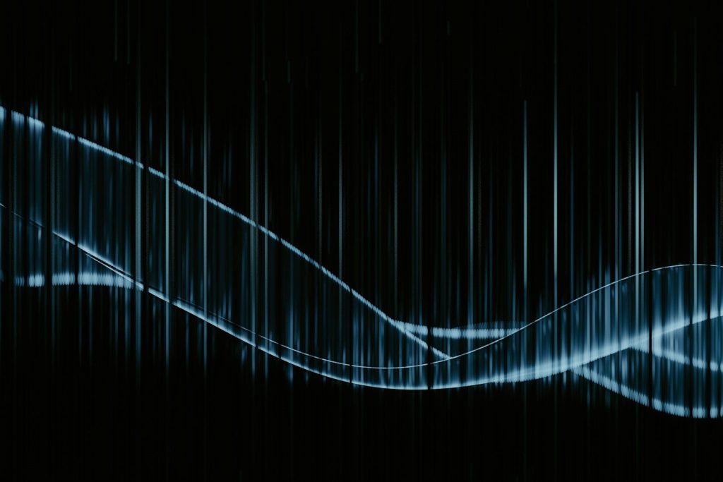 A black background with a blue wave on it