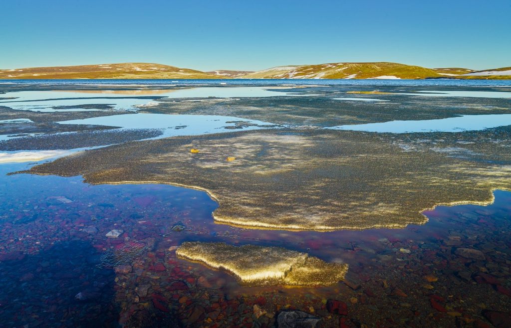 a large body of water surrounded by mountains