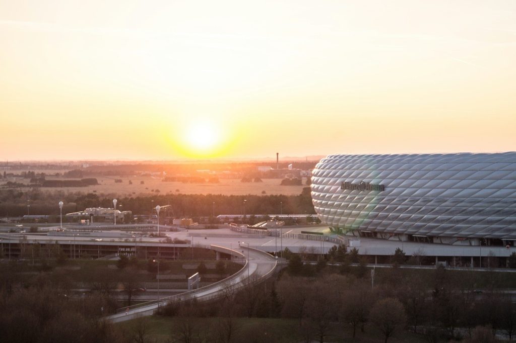 a building with a sunset in the background