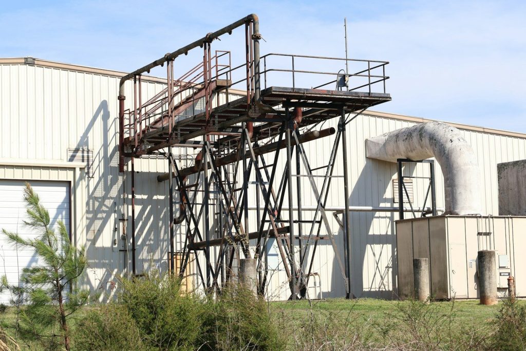 Industrial structure next to a large building