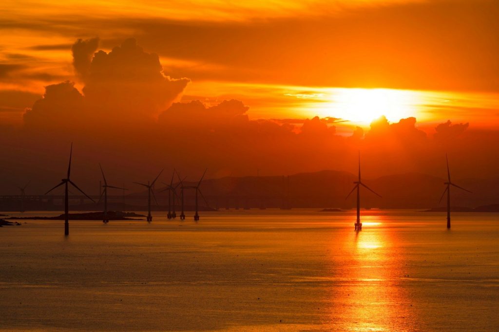 The sun is setting over a body of water