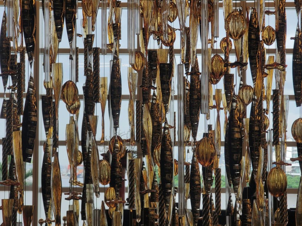 Many dried fish hanging from strings