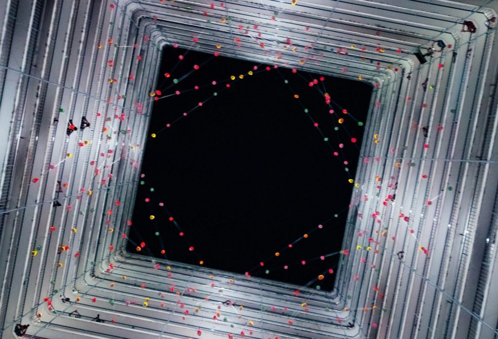 Abstract tunnel with colorful dots and black center