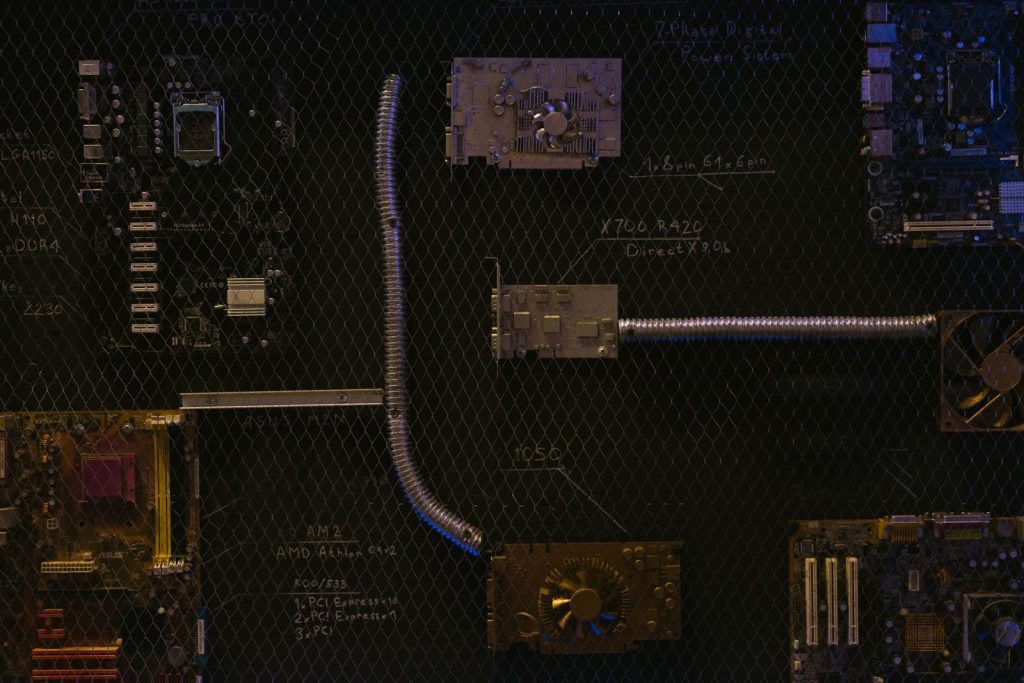 Artistic arrangement of circuit boards and cables symbolizes modern technology.