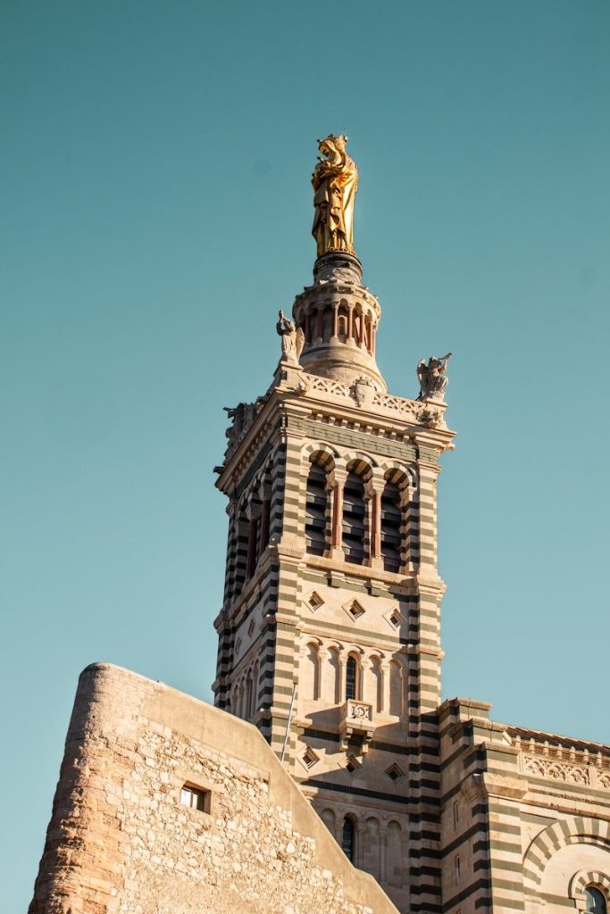 A very tall building with a clock on it's side