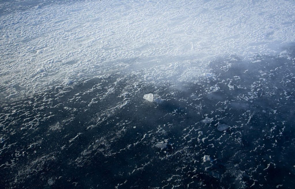 Aerial view of clouds over dark water
