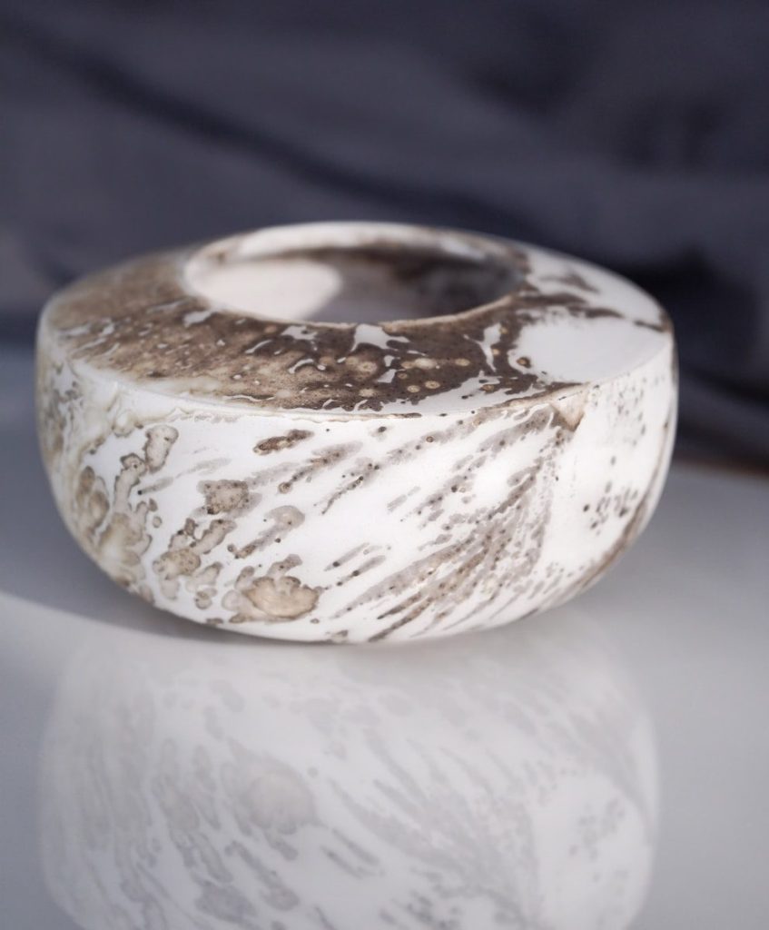 White ceramic bowl with dark marbled texture