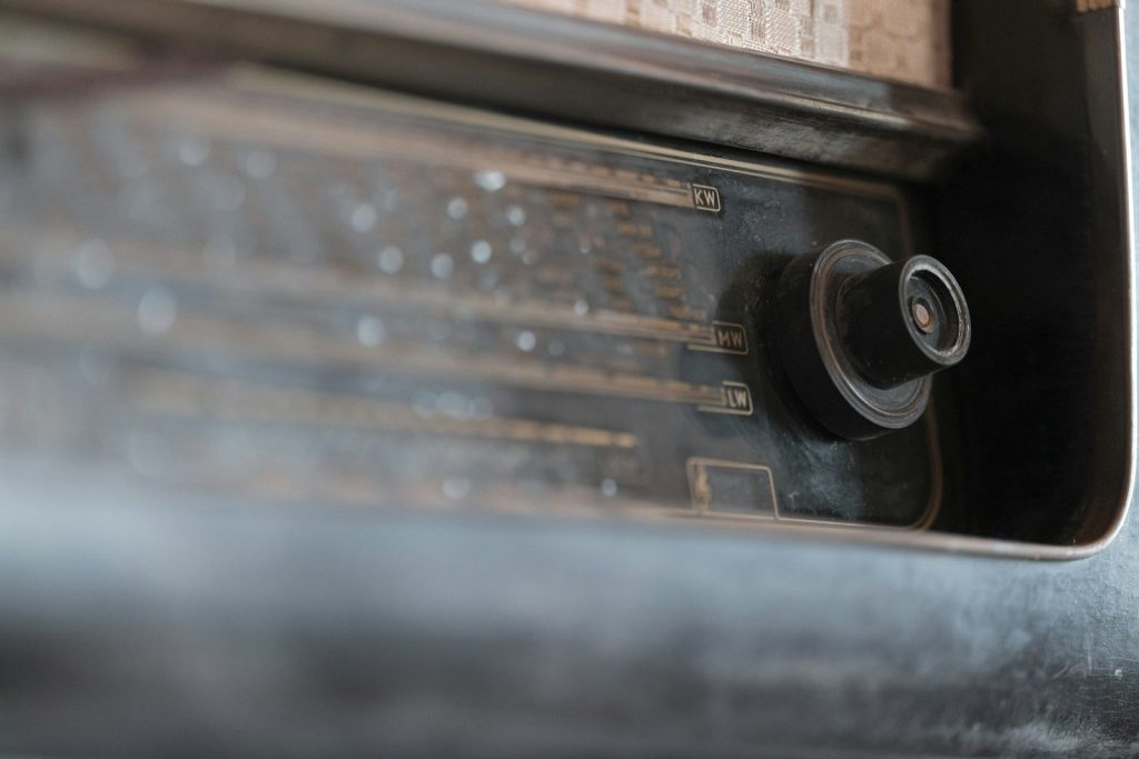 Close-up of an old radio dial with a knob