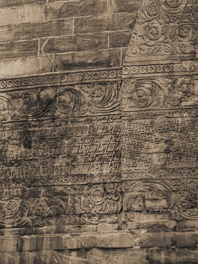 Intricate stone carvings on an ancient wall
