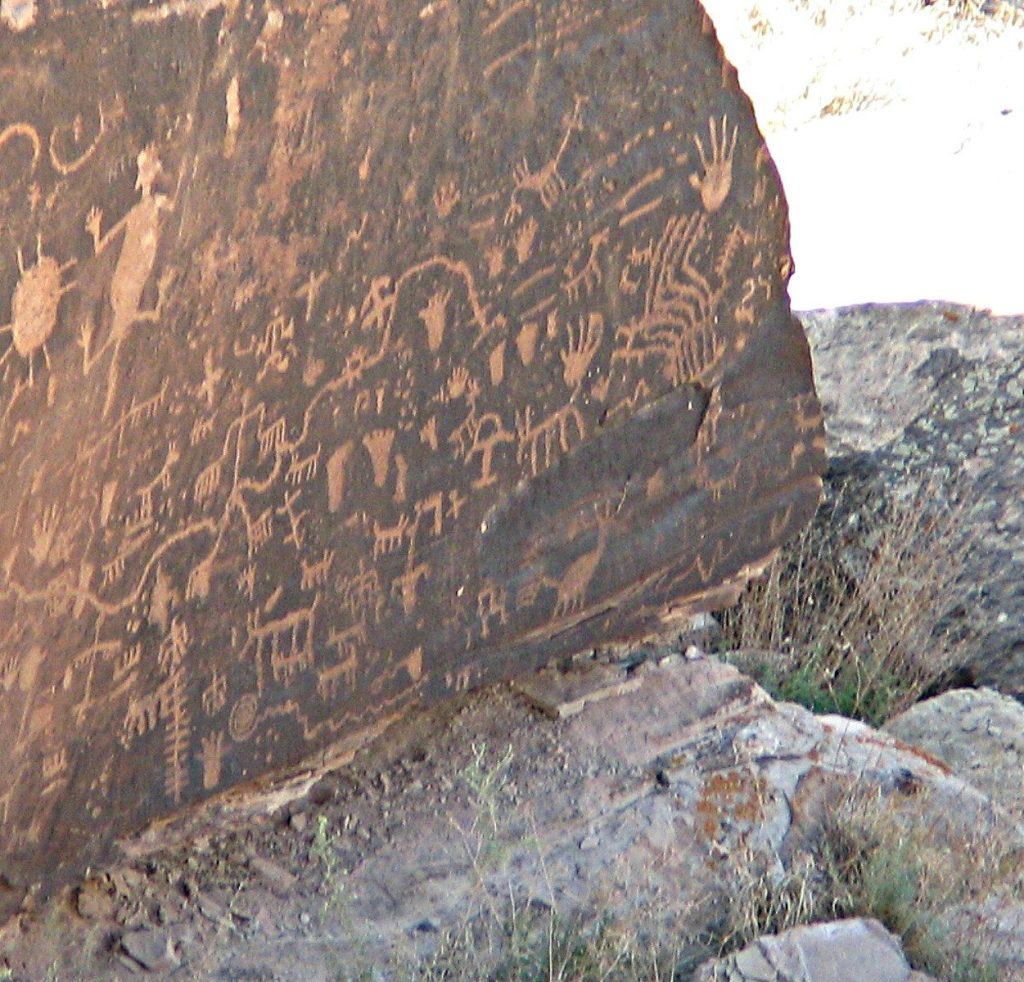 a large rock with some writing on it